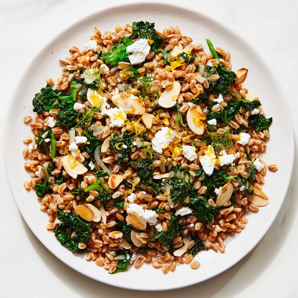 A comforting bowl of Warm Farro & Greens Pilaf, the nutty grains enticing with parsley.