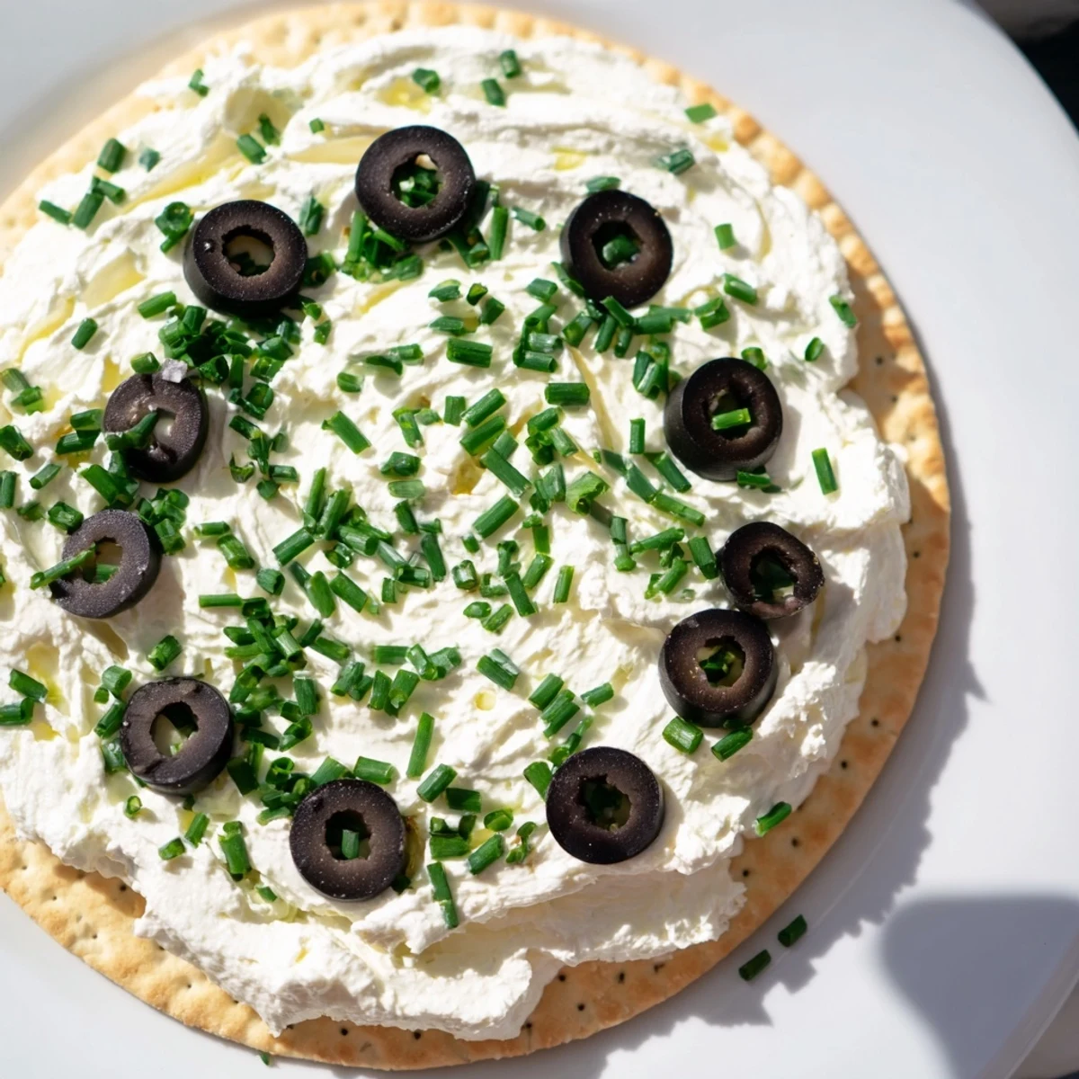 Gold Medal Olympic Ring Appetizers arranged on a platter, featuring vibrant toppings of various colors.