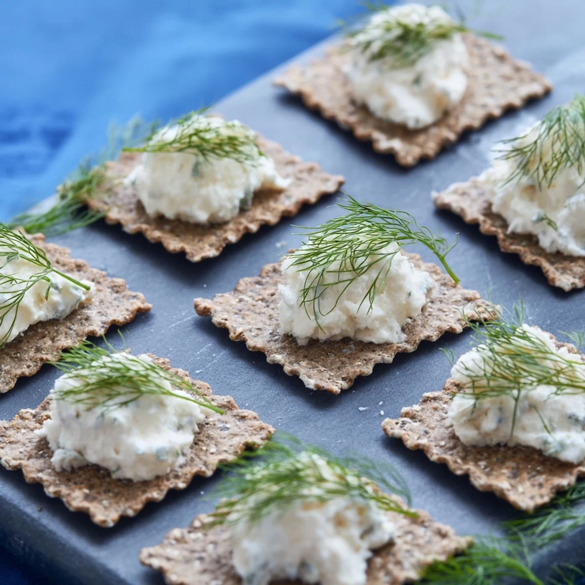 Crumbly goat cheese whitecaps top these savory Stormy Sea crackers, a delicious appetizer.