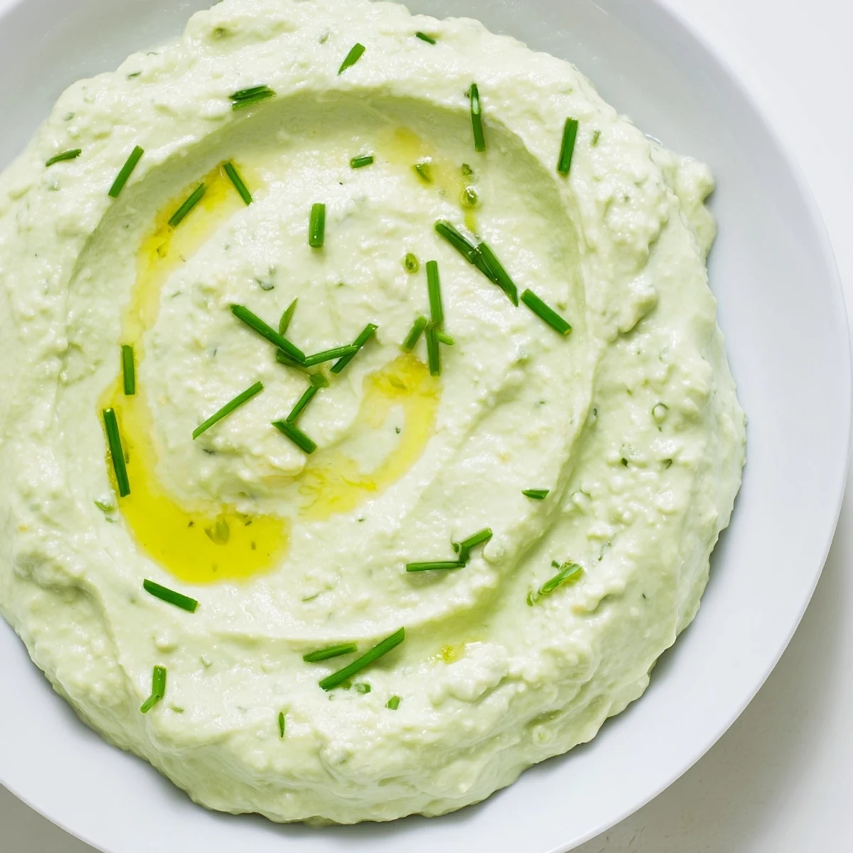 Creamy Avocado Cottage Cheese Dip, a vibrant green dip ready to serve with fresh vegetables or crackers.