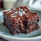 Fudgy sourdough discard brownies topped with sea salt flakes for a sweet-salty finish. Rich chocolate flavor enhanced by tangy sourdough.