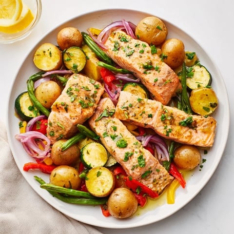 Golden potatoes and flaky salmon pieces in a delicious Salmon & Potato Skillet recipe, ready to serve.