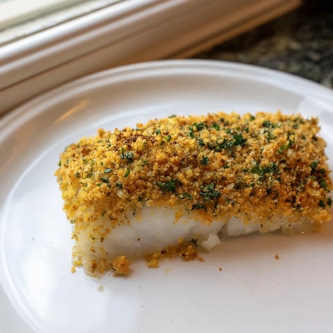 Golden, crispy Ritz cracker topping blankets flaky baked cod in this comforting dish.