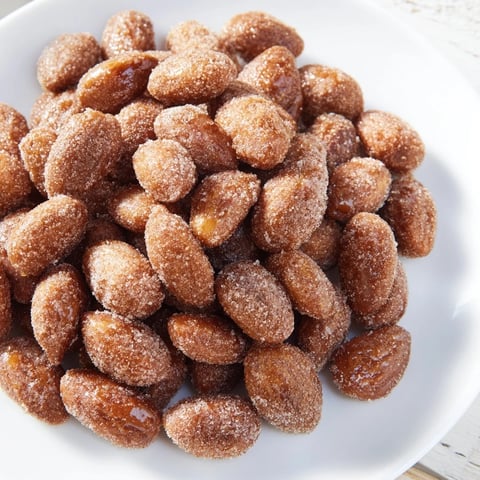 Golden and crackling cinnamon roasted almonds, perfect as a snack or delightful holiday gift.