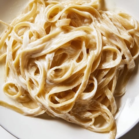 Creamy, golden Lazy Girl Three-Ingredient Pasta glistening, inviting you to enjoy this simple meal.