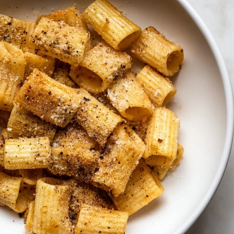 Crispy golden pasta chips, air-fried and coated with Parmesan, ready for dipping and delicious bites.
