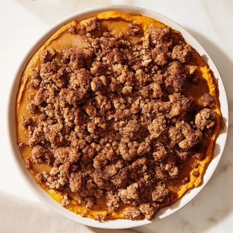 Warm, spiced Pumpkin Crisp fresh from the oven, showing off its buttery, crumbly topping.