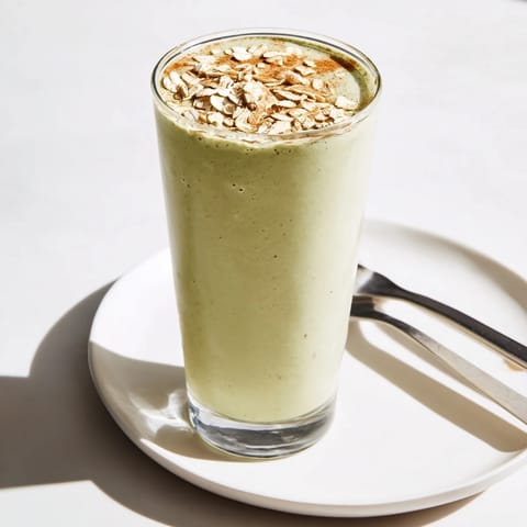 Enjoy a rich Matcha Snickerdoodle Protein Shake, a frothy, energizing breakfast with almond butter flavor.