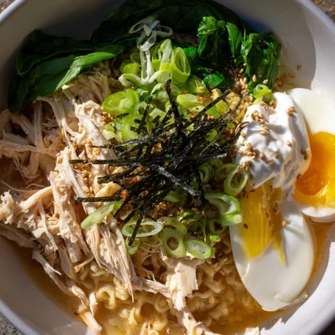 Warm bowl of Chicken Ramen showcasing tender chicken and soft egg with Kewpie mayo swirl.