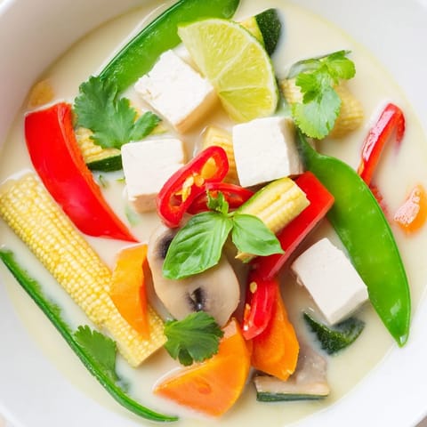 Creamy coconut milk and flavorful Thai green curry make this hot, comforting soup a delight.