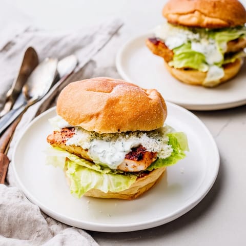 Perfect for a quick lunch, the juicy chicken contrasts with the fresh lettuce and tangy, savory sauce.