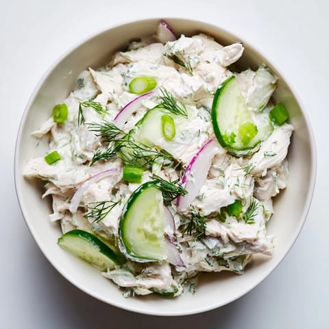 Tender chicken and crunchy cucumbers tossed in a creamy dill yogurt dressing, perfect for a light lunch or summer picnic.  