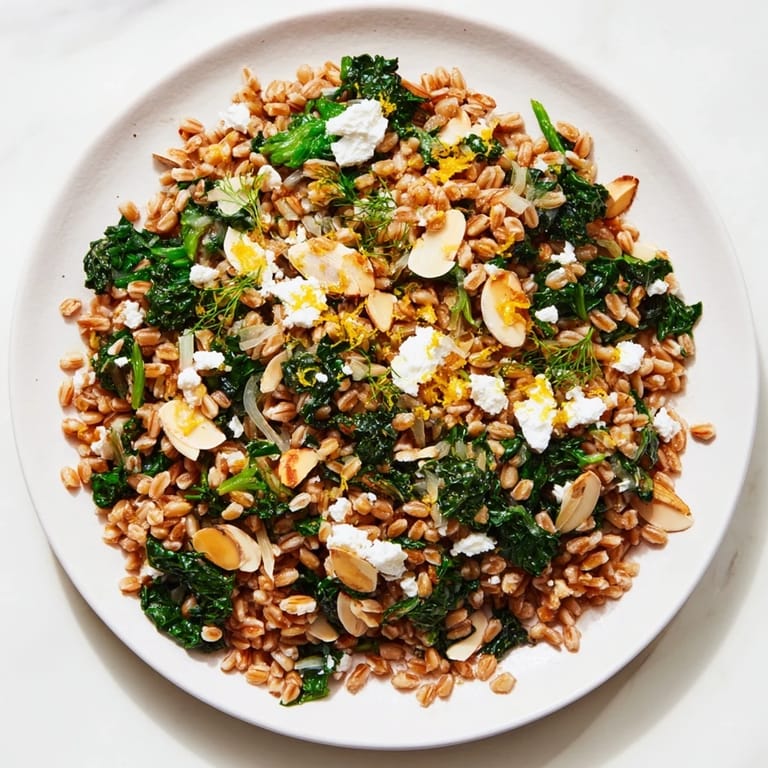 A comforting bowl of Warm Farro & Greens Pilaf, the nutty grains enticing with parsley.