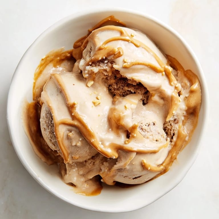 Vibrant close-up of Peanut Butter Banana Ice Cream, a healthy, frozen American dessert option.