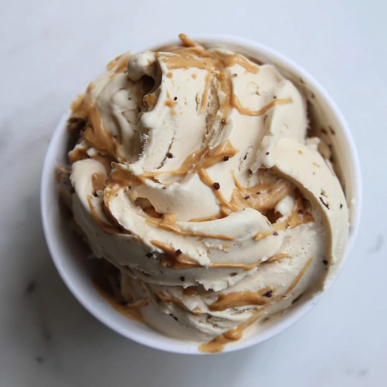 A delicious bowl of homemade Peanut Butter Banana Ice Cream, cool and inviting after blending.