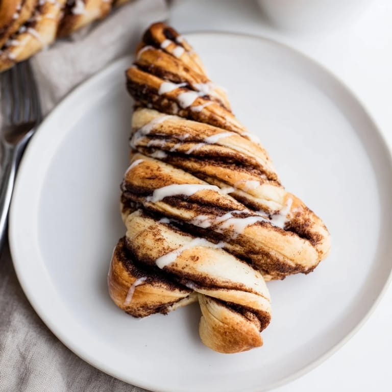 Fluffy, layered Cinnamon Swirl Christmas Tree Bread with a delicious cinnamon-sugar filling, ready to serve.