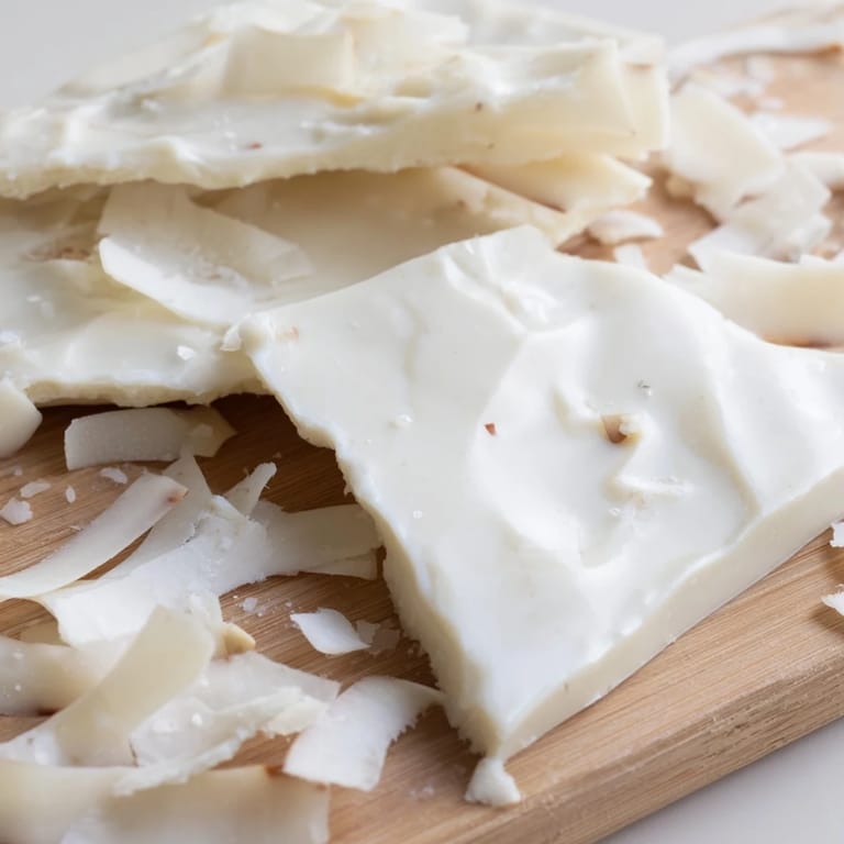 Thin white chocolate ice sheets and savory parmesan shards create this stunning and minimalist Arctic Tundra course.