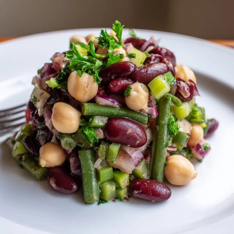 Easy Three-Bean Salad with colorful beans and a light dressing, perfect for picnics, potlucks, or healthy weeknight dinners.