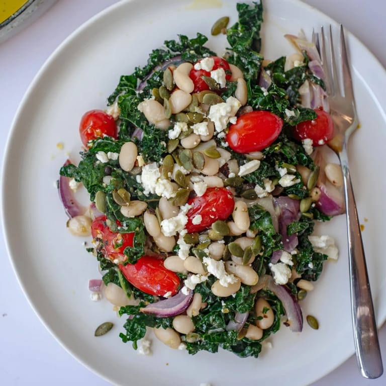Vibrant White Bean and Kale Salad with kale leaves massaged in lemon-garlic dressing, ideal for a light lunch.