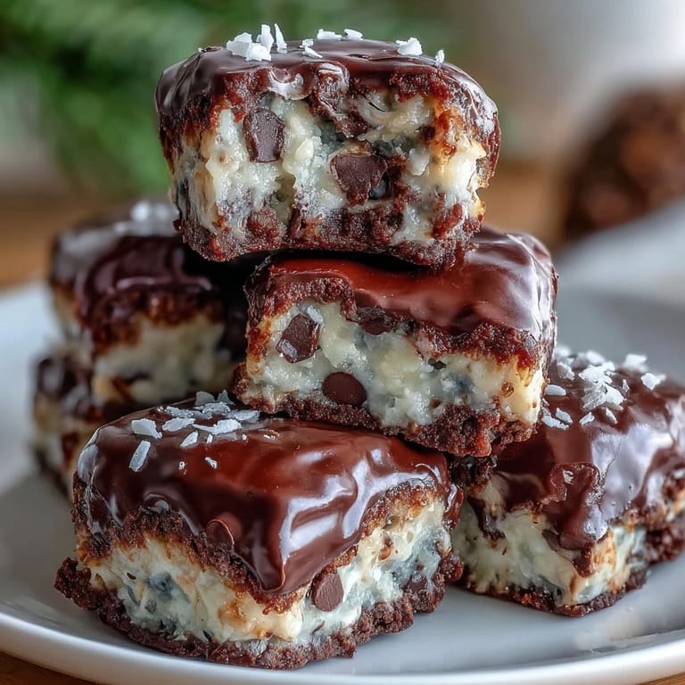 Fudgy no-bake Moose Bites with chocolate chips and sweetened condensed milk on a marble counter.