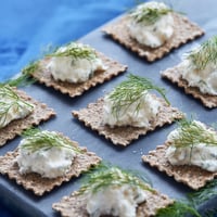 Crumbly goat cheese whitecaps top these savory Stormy Sea crackers, a delicious appetizer.
